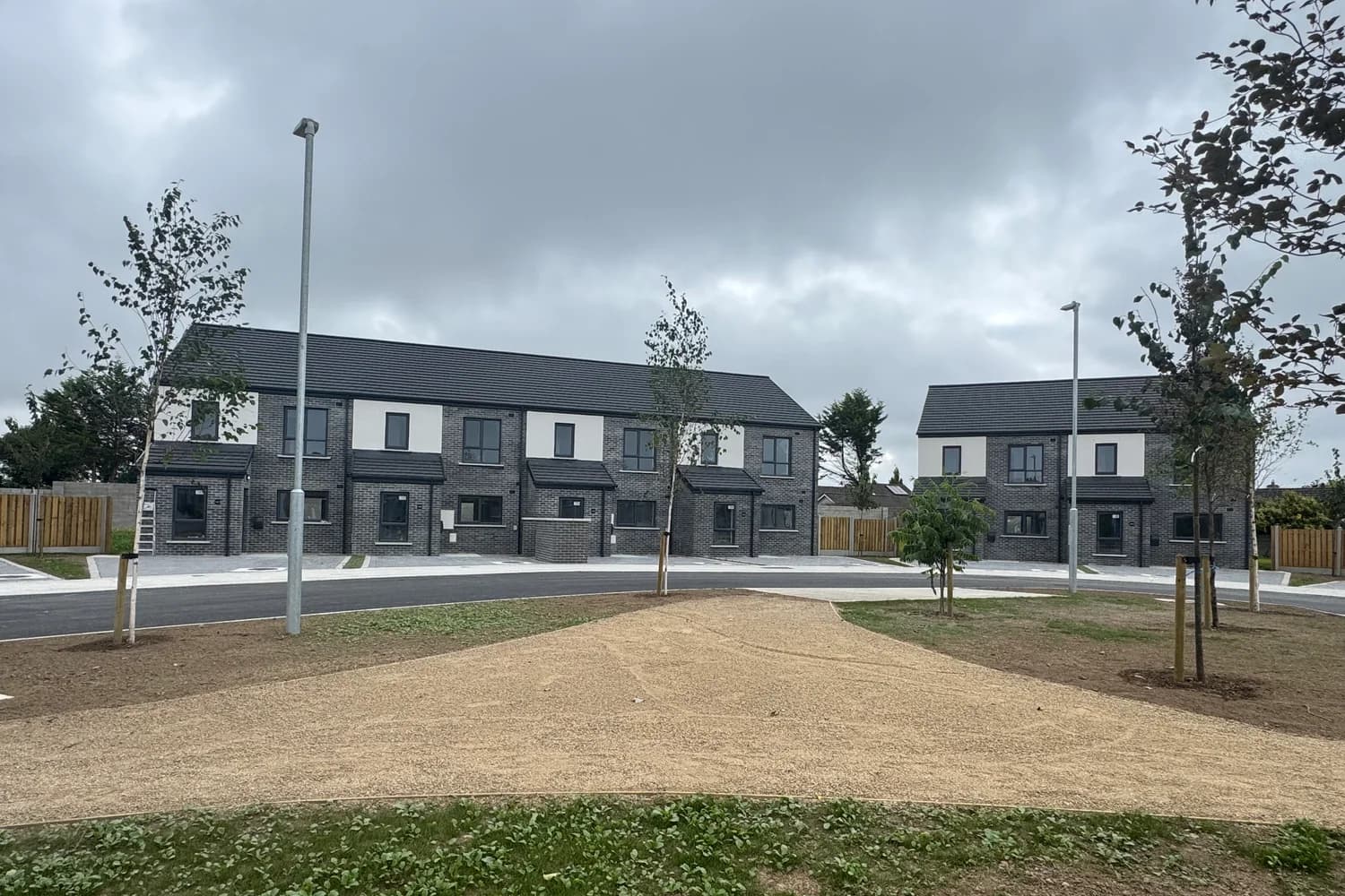 Completed homes and shared green space at a Dingle development